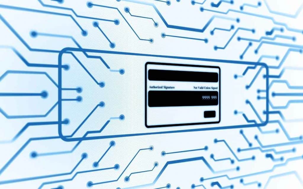 En la imagen se ve un chip de una tarjeta de debito o credito en un entorno cibernético para ejemplificar como funcionan las pasarelas de pago